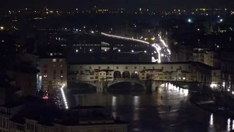 4K Aerial view old bridge in Florence downtown by night famous landmark emblem Stock Footage 74003745