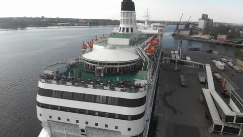 4k aerial view of open deck restaurant on cruise ship moored to the pier Stock Footage 112870167