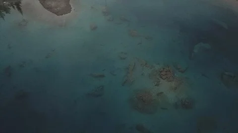 4K Aerial View over Mountain lake in autumn, winter with snow and forest and way Stock Footage 90773619