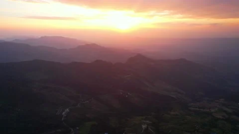 4K Aerial view over the mountains at sunset. Drone Flight Footage  Stock Footage 167991862