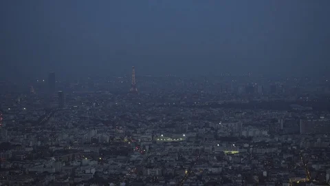 4K Aerial view of Paris with the Eiffel Tower illuminated at night - EDITORIAL Stock Footage 77193210