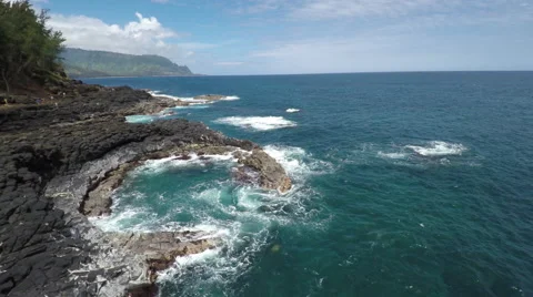 4K aerial view of Queen's Bath in Kauai Hawaii Stock Footage 63382851
