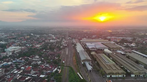 4K Aerial View Red Sunset Over Indonesian Railway Industries Madiun Stock Footage 274922954