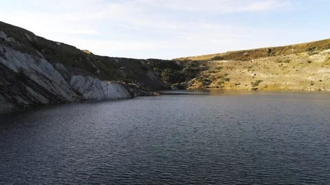 4K Aerial View Reverse Flight Over Quarry Lake Water Stock Footage 116037378