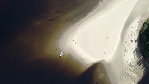 4K Aerial View of River Beach with Fisherman – Peaceful Nature Scene Stock Footage 314522492