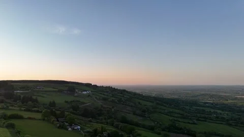 4K Aerial View of Rolling Hills and Rural Landscape at Sunset Stock Footage 333932658