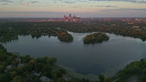 4K Aerial View Rotating Around Lake Of The Isles And Minneapolis Skyline Stock Footage 220469631