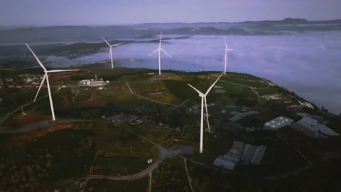 4K Aerial View Of Sea of Clouds and Windmills at Cau Dat Tea Hill, Vietnam Stock Footage 322561336