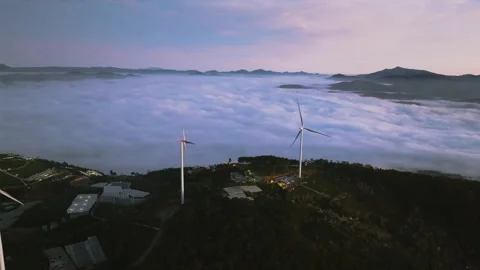 4K Aerial View Of Sea of Clouds and Windmills at Cau Dat Tea Hill, Vietnam Stock Footage 322562486
