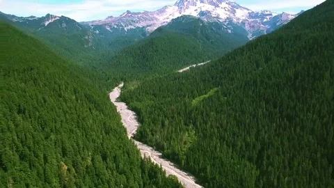 4K aerial view Seattle below Mount Rainier above lake Stock Footage 69214624