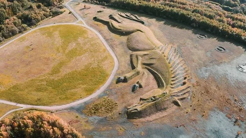 4k aerial view shape of a pit pony on top of a closed, reclaimed coal mine Video stock 154061228