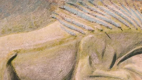 4k aerial view shape of a pit pony on top of a closed, reclaimed coal mine Video stock 154062140