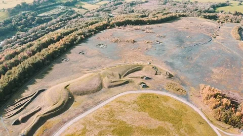 4k aerial view shape of a pit pony on top of a closed, reclaimed coal mine Stock Footage 154062458