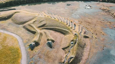 4k aerial view shape of a pit pony on top of a closed, reclaimed coal mine Stock Footage 154062662