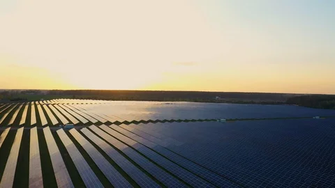 4K Aerial view of Solar Panels Farm (solar cell) with sunlight.Drone flight f Видео 129296971