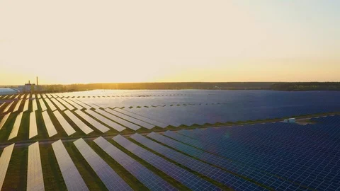 4K Aerial view of Solar Panels Farm (solar cell) with sunlight.Drone flight f Stock Footage