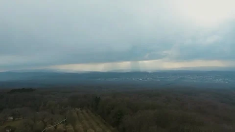 4K Aerial View of a Storm Approaching a Scenic Landscape Stock Footage 282444041