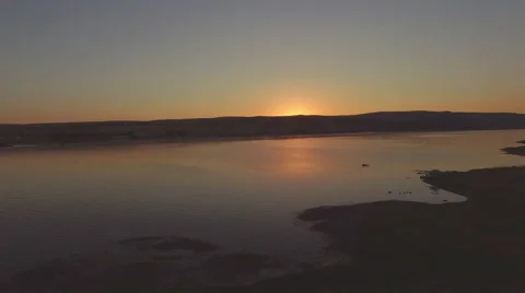 4k Aerial View of Sunset Over a Lake Stock Footage 53501267