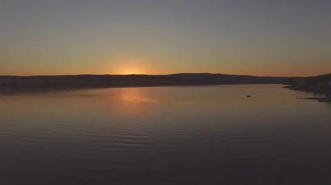 4k Aerial View of a Sunset Over a Lake Stock Footage 53501846