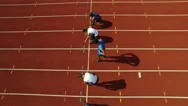 4K Aerial View Of Track Athletes At Running Track, Competing In A Race Stock Footage