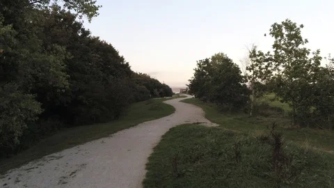 4K Aerial View Tracking Along Path Before Flying Over River Stock Footage 116029571