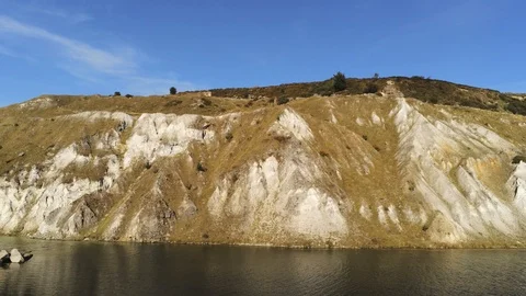 4K Aerial View Tracking Along Quarry Lakeside Stock Footage 116033134