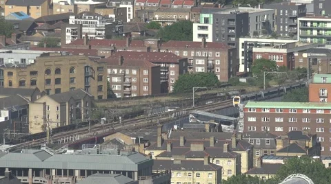 4K Aerial view train pass connect suburban area London downtown people travel UK Video stock 59847885