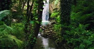 4K Aerial View Of Waterfall In Jungle Paradise Stock Footage