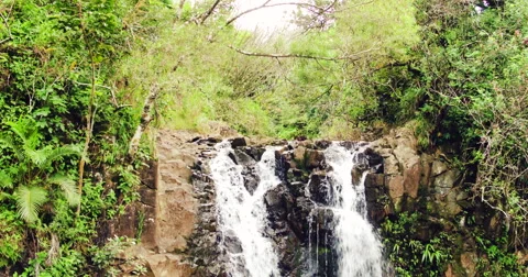 4K Aerial View of Waterfall in Jungle Paradise Stockbeeldmateriaal 56877652