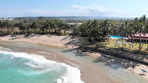 4K Aerial View of Waves Rolling onto a Pristine Beach Video stock 294455438