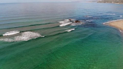 4k aerial waves motion along mediterranean sea coast Stock Footage 104371887