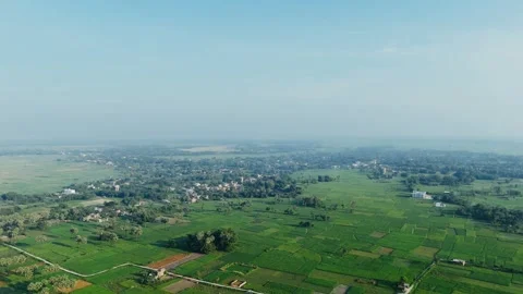 4K Aerial: Winding River Through Lush Green Fields - Rural Morning Tranquility. Stock Footage 318725253