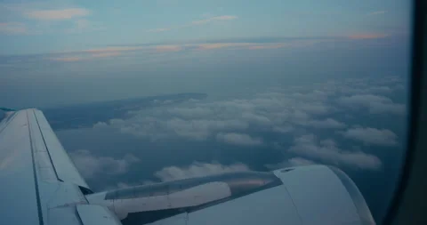 4k Aerial Window View of Wing and Turbine with Passing Clouds at Twilight Stock Footage 343611694
