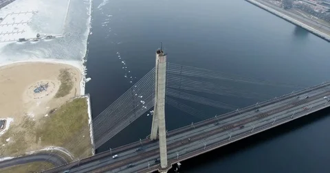4K Aerial winter view of cable-stayed bridge over Daugava river in Riga Latvia 動画素材 72281956
