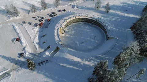 4K Aerial zoom on a circular building that looks like a bunker Stock Footage