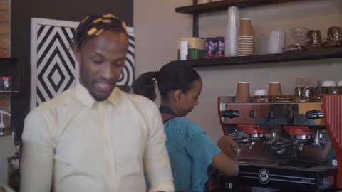 4K african handsome man serving customers at the counter. Stock-Footage 111340591
