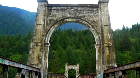 4K Aged Concrete Arch, Abandoned Bridge Across River in Forest Video stock 67997540