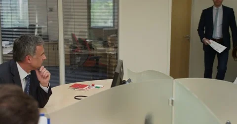 4K Aggressive business manager yelling at male employee &amp; throwing papers Stock Footage 76743117
