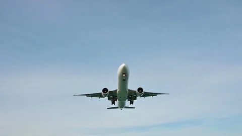 4K Airplane flying over head with landing gear down Stock Footage 101034507