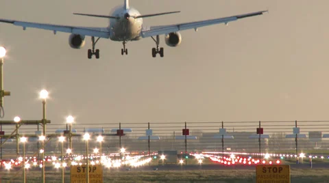 4K Airplane landing at dusk Stock Footage 34760153