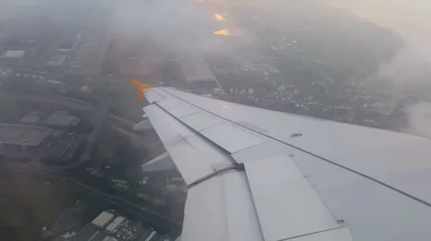 4k airplane takeoff through the clouds then see sunset. Stock Footage 58463060