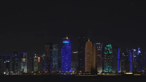 4K Amazing modern skyscraper tower by night Doha landmark panoramic view emblem Stock Photos