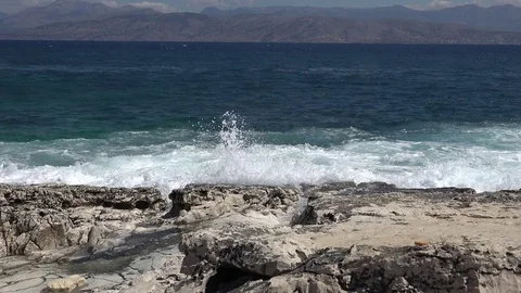 4K Amazing sea wave splash foam on rocky coastline Corfu Island noisy shore isle Stock Footage 78768352