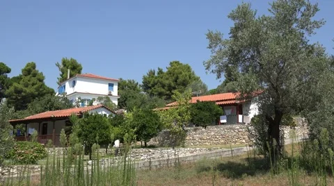 4K Amazing traditional architecture Greek white house Skiathos Island olive tree Stock Footage