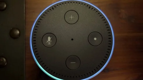 4K Amazon Alexa Echo Dot from above, activating and responding to voice command Stock Footage 106773995