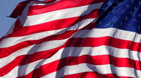 4K American Flag Waves Free Blue Sky Background Stock Footage