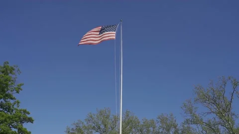 4K. American flag waving in the wind on a Sunny day. Stock Footage 130590357