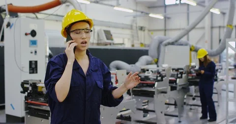 4K Angry &amp; assertive factory manager dealing with a problem over the phone 動画素材 101955759