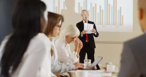 4K Angry business manager throwing papers &amp; shouting at employees in a meeting Stock Footage 101437817