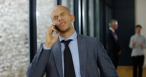 4K Angry businessman arguing over the phone at a business conference Stock Footage 101411912